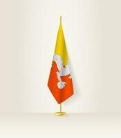 Butão bandeira em uma bandeira ficar em pé. vetor