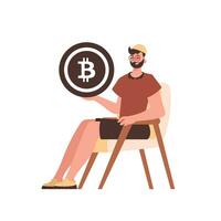 a cara senta dentro uma cadeira e detém uma bitcoin dentro a Formato do uma moeda dentro dele mãos. personagem com uma moderno estilo. vetor