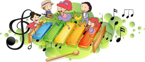 xilofone com muitas crianças felizes e símbolos de melodia na mancha verde