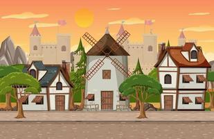 Cena de vila medieval com moinho de vento e casas vetor