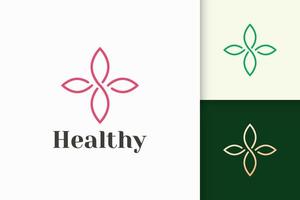 logotipo da flor em estilo feminino e luxuoso para saúde e beleza vetor