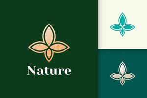 logotipo da flor em forma de folha simples e luxuosa para saúde e beleza vetor