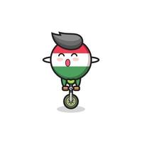 a fofa personagem do distintivo da bandeira da Hungria está andando de bicicleta de circo vetor