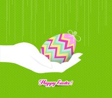 mão de Páscoa feliz segurando um ovo vetor