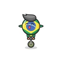 o personagem fofo do distintivo da bandeira do brasil está andando de bicicleta de circo vetor