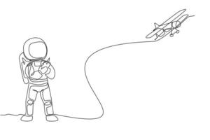 um desenho de linha única do astronauta jogando o controle de rádio do avião na ilustração gráfica do vetor da terra da lua. fazendo hobby enquanto tempo de lazer no conceito de espaço profundo. design moderno de desenho de linha contínua