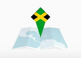 Jamaica é retratado em uma guardada papel mapa e fixado localização marcador com bandeira do Jamaica. vetor