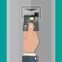 desenho animado mão inserções uma crédito débito cartão para dentro atm. vetor ilustração dentro plano Projeto em verde fundo