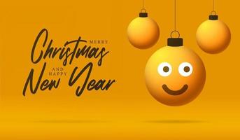 cartão de feliz Natal com rosto de emoji de sorriso. ilustração vetorial em estilo simples com letras de natal e emoção na bola de natal pendurada no fio no fundo vetor