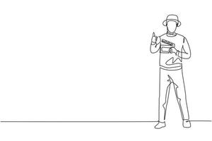 o diretor de filme de desenho de linha contínua única fica de pé com um gesto de polegar para cima enquanto segura a claquete para preparar a equipe de câmera para a filmagem. uma linha desenhar ilustração em vetor design gráfico.