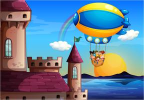 Um balão flutuante com crianças indo para o castelo vetor