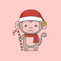 Macaco bonito dos desenhos animados de Natal segurando um bastão de doces vetor