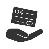 Abra a mão com o ícone de glifo do cartão de crédito. símbolo da silhueta. pagamentos seguros. espaço negativo. ilustração isolada do vetor