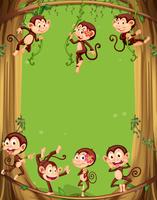 Design de fronteira com macacos na árvore vetor