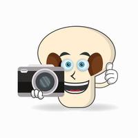 personagem de mascote de cogumelos segurando a câmera. ilustração vetorial vetor