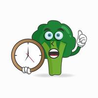 personagem mascote de brócolis segurando um relógio de parede. ilustração vetorial vetor