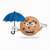 personagem de mascote de biscoitos segurando um guarda-chuva. ilustração vetorial vetor