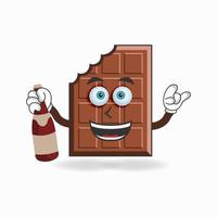 personagem de mascote de chocolate segurando uma garrafa. ilustração vetorial vetor