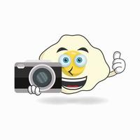 personagem de mascote de ovo segurando a câmera. ilustração vetorial vetor