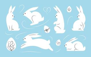Páscoa Coelho coleção. branco coelhos dentro diferente poses e Páscoa ovos em azul fundo. vetor