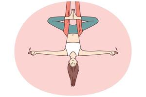 mulher fazendo aéreo ioga trava parte de cima baixa dentro maca e mantém Saldo com braços às lados vetor