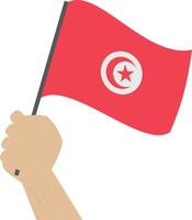mão segurando e levantando a nacional bandeira do Tunísia vetor