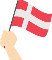 mão segurando e levantando a nacional bandeira do Dinamarca vetor