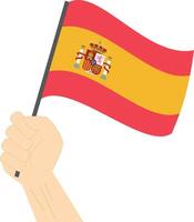 mão segurando e levantando a nacional bandeira do Espanha vetor