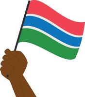 mão segurando e levantando a nacional bandeira do Gâmbia vetor