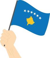 mão segurando e levantando a nacional bandeira do Kosovo vetor