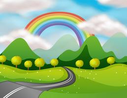 Bela natureza estrada sob o arco-íris vetor
