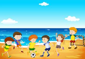 Meninos jogando futebol na praia vetor