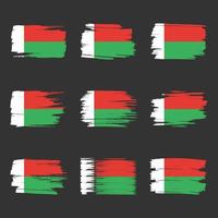 Traçados de pincel da bandeira de madagascar pintados vetor