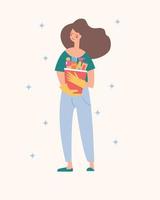 uma linda menina morena tem um balde de produtos de limpeza nas mãos. ilustração vetorial. vetor