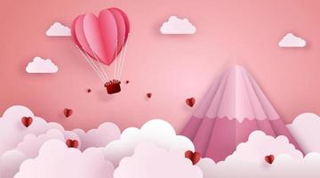 arte de corte de papel e estilo de artesanato digital do conceito de amor e dia dos namorados. origami de balão de ar quente voando sobre o céu e a nuvem com corações flutuantes e montanha.