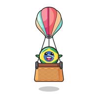 mascote da bandeira do brasil pilotando um balão de ar quente vetor