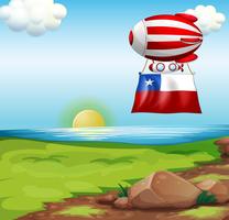 Um balão flutuante viajando com a bandeira do Chile