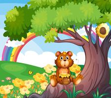 Um urso debaixo da árvore com um arco-íris na parte de trás vetor