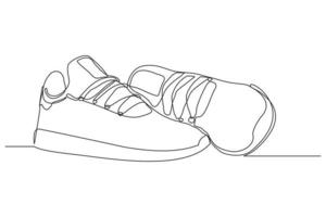 desenho de linha contínua de sapatos de tênis casuais. arte única de uma linha de sapatos esportivos. ilustração vetorial vetor