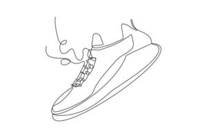 desenho de linha contínua de sapatos de tênis casuais. arte única de uma linha de sapatos esportivos. ilustração vetorial vetor