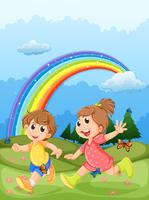 Crianças brincando no topo da colina com um arco-íris no céu vetor