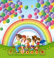 Uma bicicleta multi-rodas abaixo dos balões flutuantes perto do arco-íris vetor