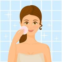 jovem cuida da pele do rosto, limpando o rosto com esponja