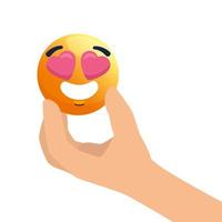 mão com emoji adorável, rosto amarelo com corações nos olhos, sobre fundo branco vetor