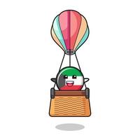 mascote da bandeira do kuwait montando um balão de ar quente vetor