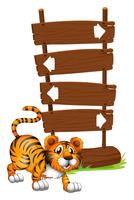 Tigre na frente de uma tabuleta de madeira vetor