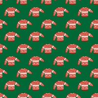 padrão de Natal sem costura brilhante com enfeite de camisola quente. roupas aconchegantes vermelhas sobre fundo verde. vetor