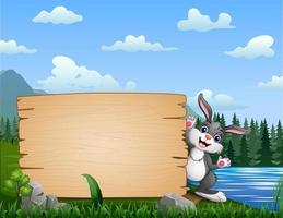 desenho animado um coelho com sinal em branco na beira do rio vetor