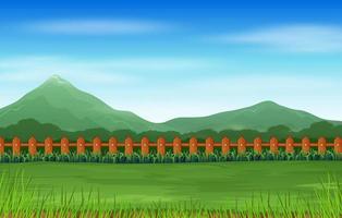 uma paisagem de montanha com campo verde vetor