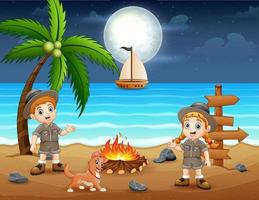 crianças escoteiras felizes curtindo a fogueira na praia vetor